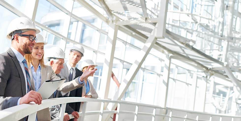 Work team standing and clapping during meeting